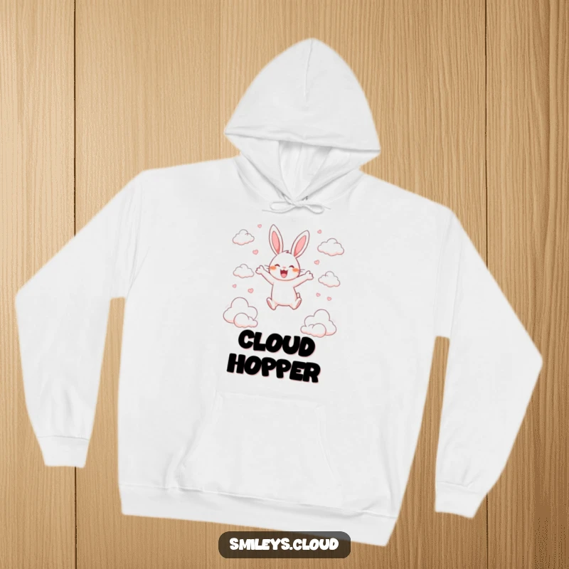 Funny hoodie with a happy rabbit leaping enthusiastically between scattered clouds, expressing pure delight.