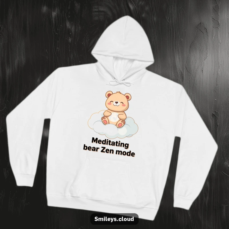 Funny meditating bear hoodie with a happy bear in a meditative pose on a cloud, offering ultimate comfort.
