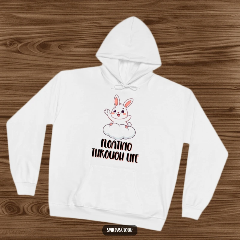 Funny Bunny Hoodie: A happy bunny waves from a cloud, offering cozy comfort and humorous charm, a perfect gift.