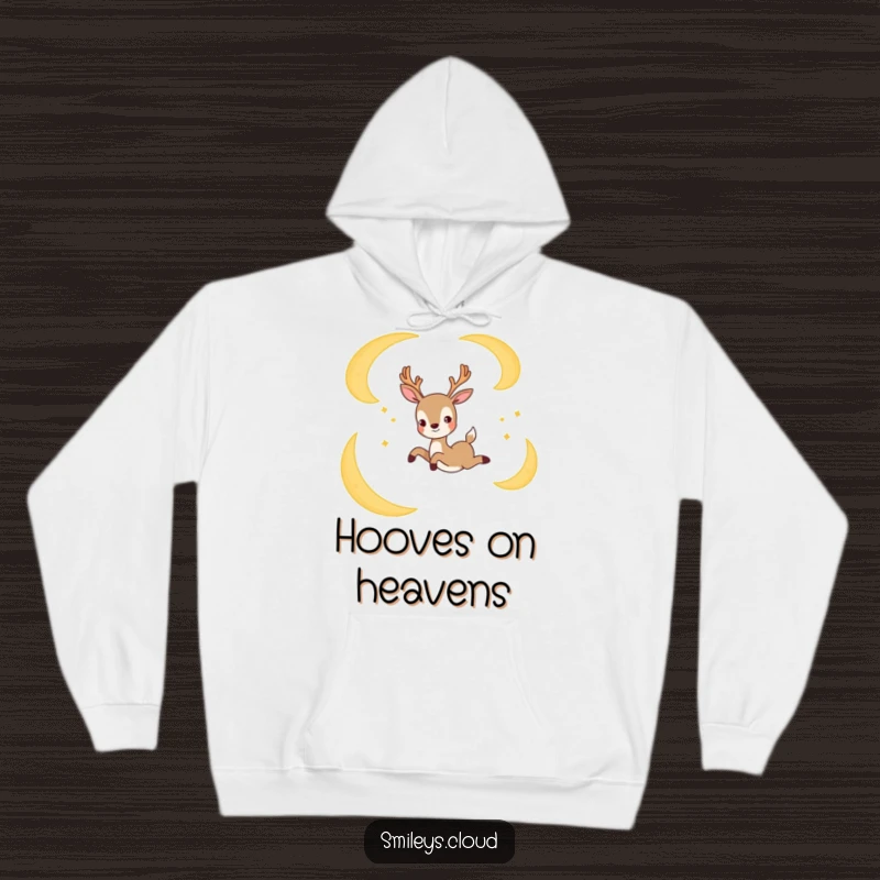 Funny hoodie featuring a joyful deer gracefully leaping between crescent moons, offering cozy comfort and celestial charm.