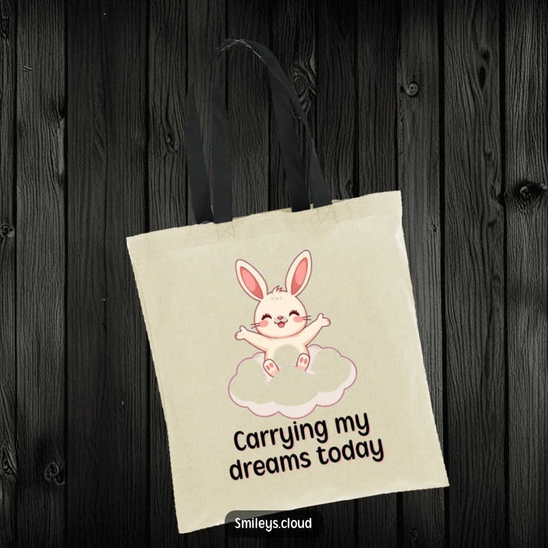 Funny cute bunny floating on a fluffy cloud, arms outstretched, on a durable tote bag.